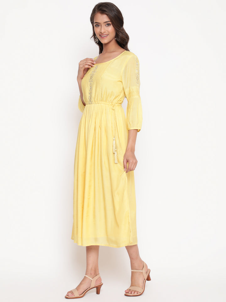 Woman posing in Embroidered Flared Tie Up Yellow Dress