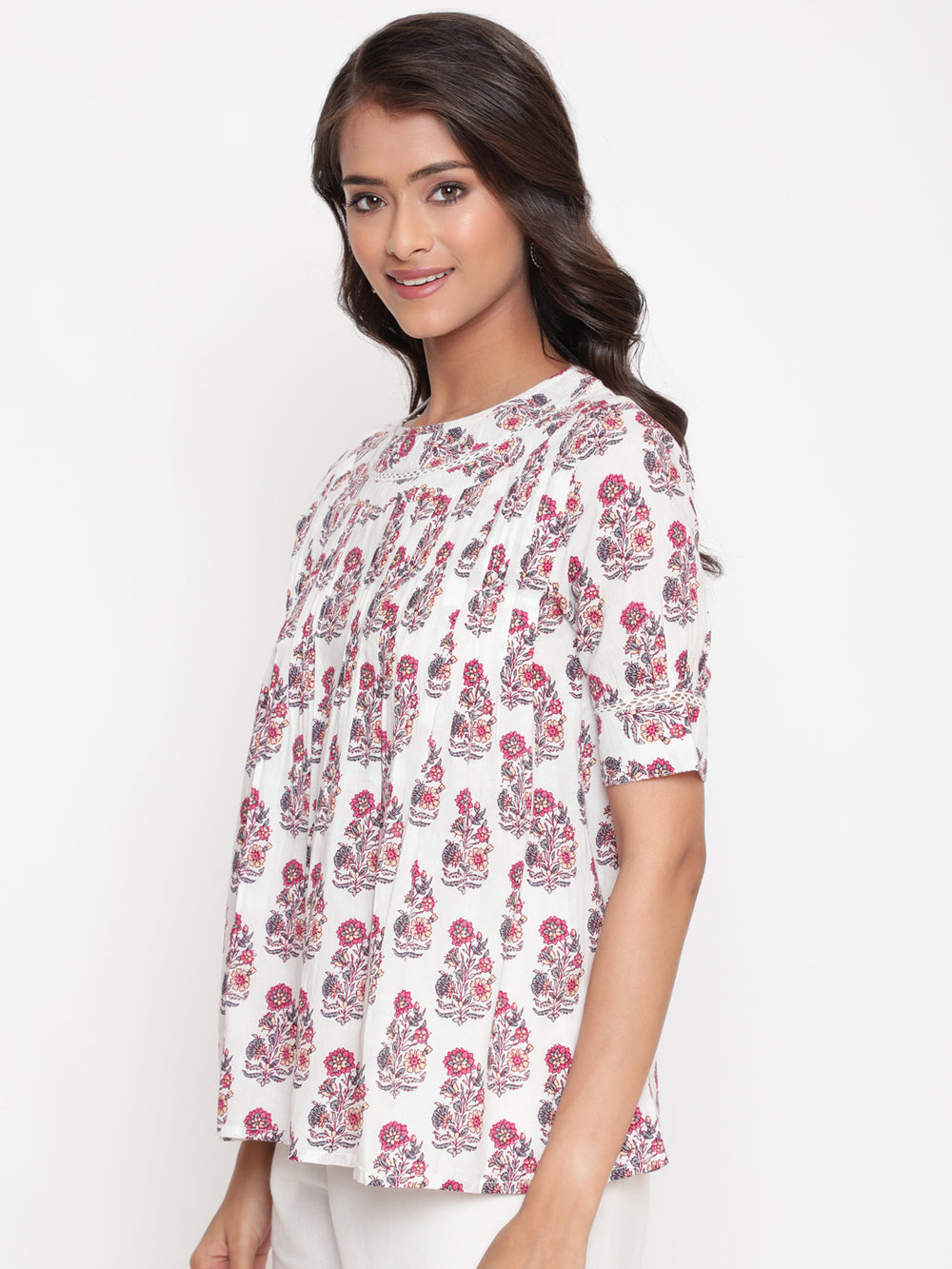 Woman posing in Savi's Cotton Printed White Pintuck Tunic