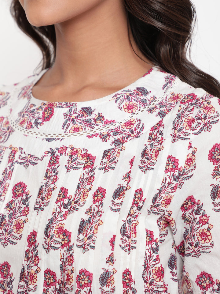 Woman posing in Savi's Cotton Printed White Pintuck Tunic