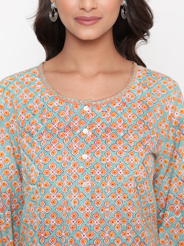 Woman posing in Savi's Cotton Printed Mint Pintuck Tunic