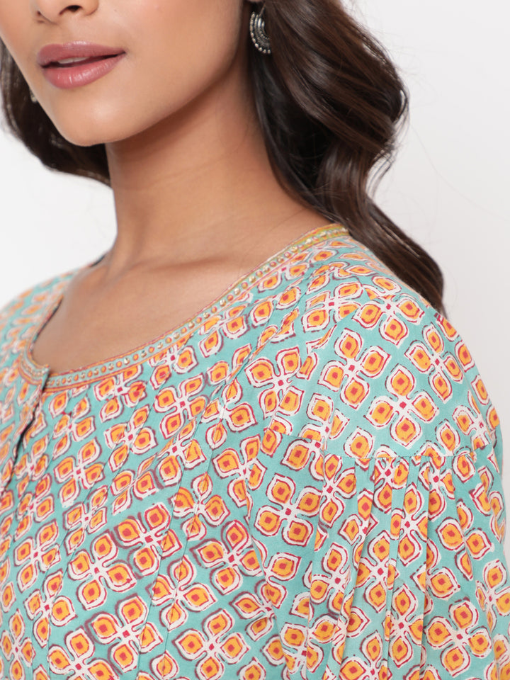 Woman posing in Savi's Cotton Printed Mint Pintuck Tunic