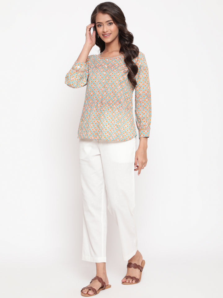 Woman posing in Savi's Cotton Printed Mint Pintuck Tunic