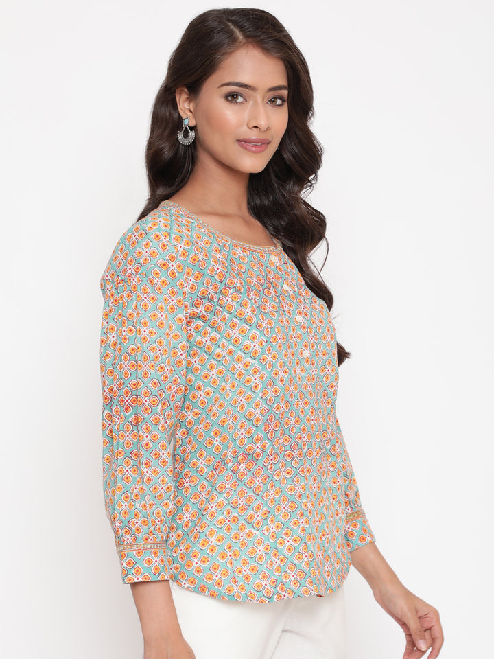 Woman posing in Savi's Cotton Printed Mint Pintuck Tunic