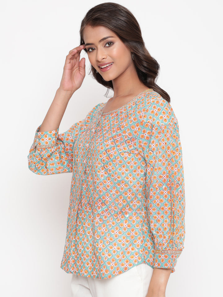 Woman posing in Savi's Cotton Printed Mint Pintuck Tunic