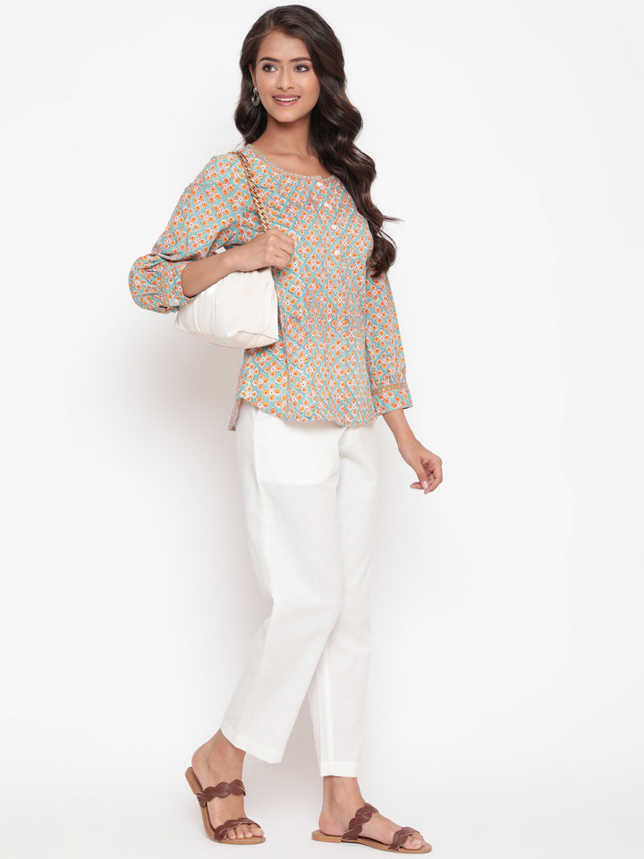 Woman posing in Savi's Cotton Printed Mint Pintuck Tunic
