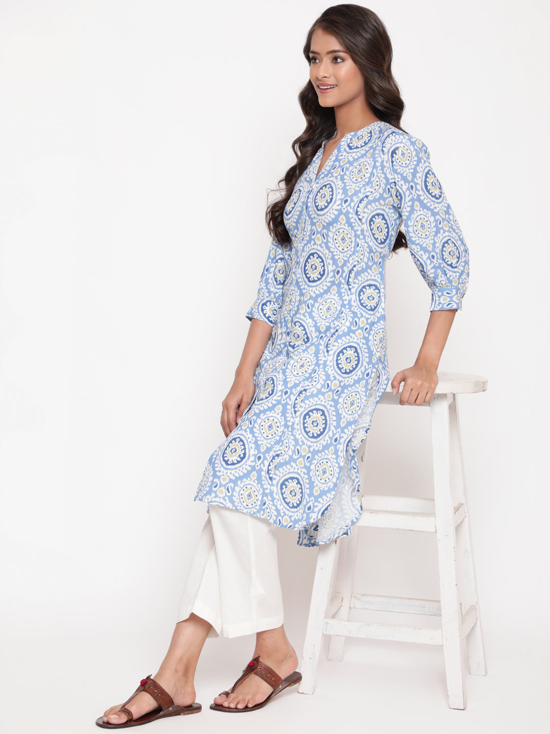 Woman posing in Savi's Blue Ikat Printed Mandarin Collar Kurta