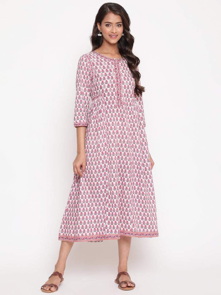 Woman posing in Savi's Cotton Block Printed White Flared Dress