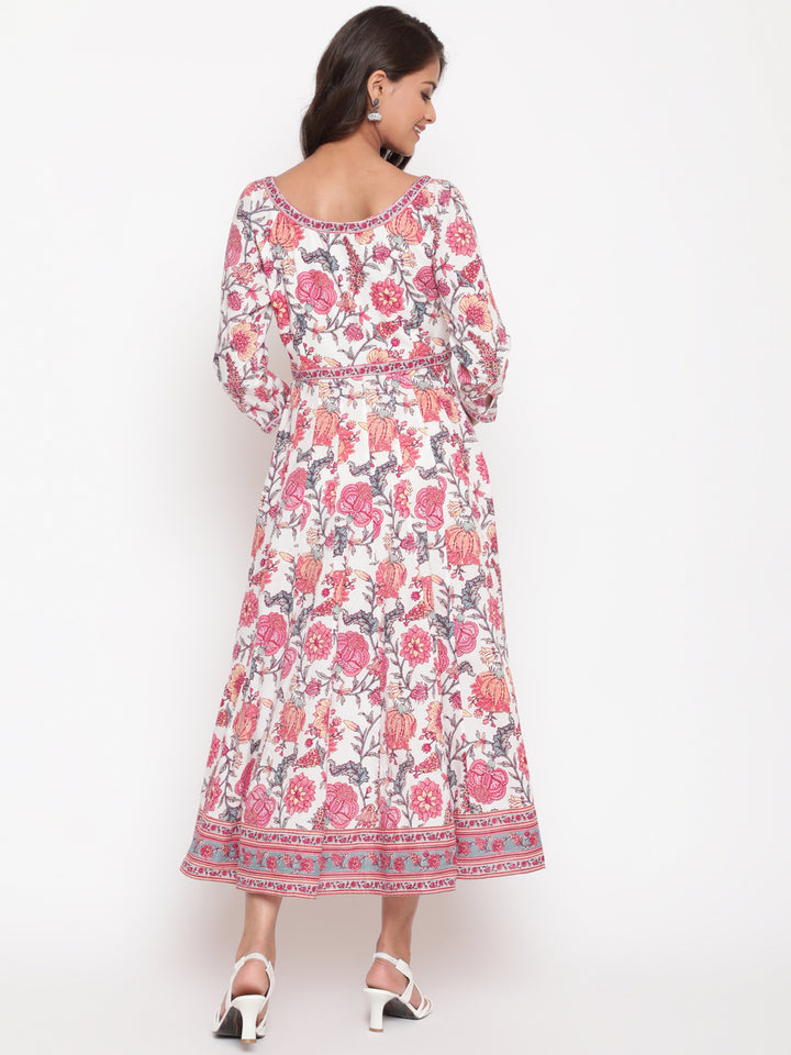 Woman posing in Savi's White Cotton Floral Flared Long Dress