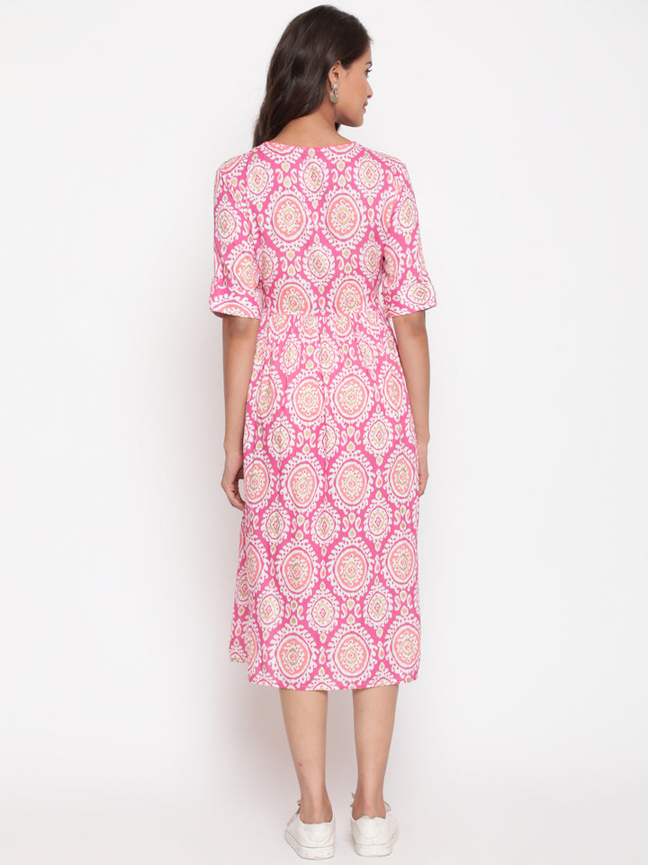Woman posing in Savi's Designer Pink Ikat Printed Dress
