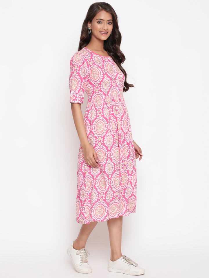 Woman posing in Savi's Designer Pink Ikat Printed Dress