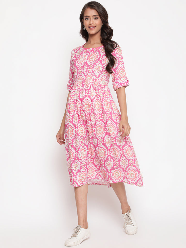 Woman posing in Savi's Designer Pink Ikat Printed Dress