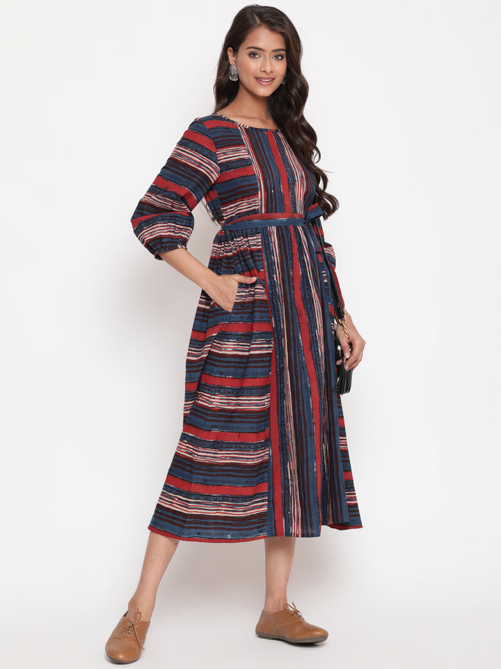Woman posing in Savi's Bagru Printed Striped Tie up Designer Dress