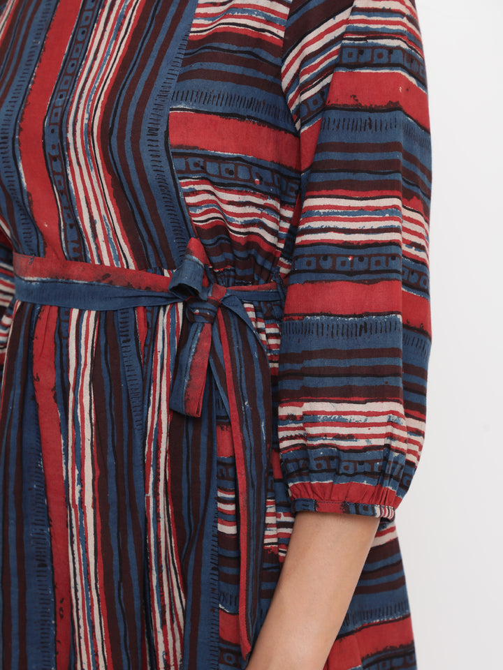 Woman posing in Savi's Bagru Printed Striped Tie up Designer Dress