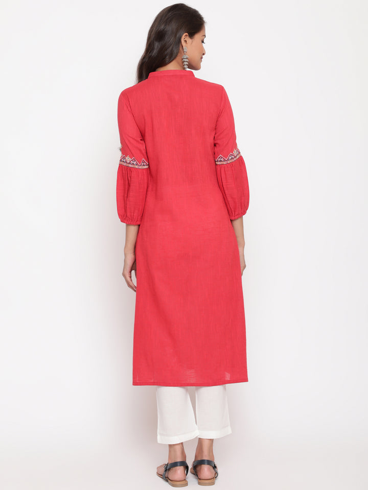 Woman posing in Red Embroidered Designer A Line Kurta