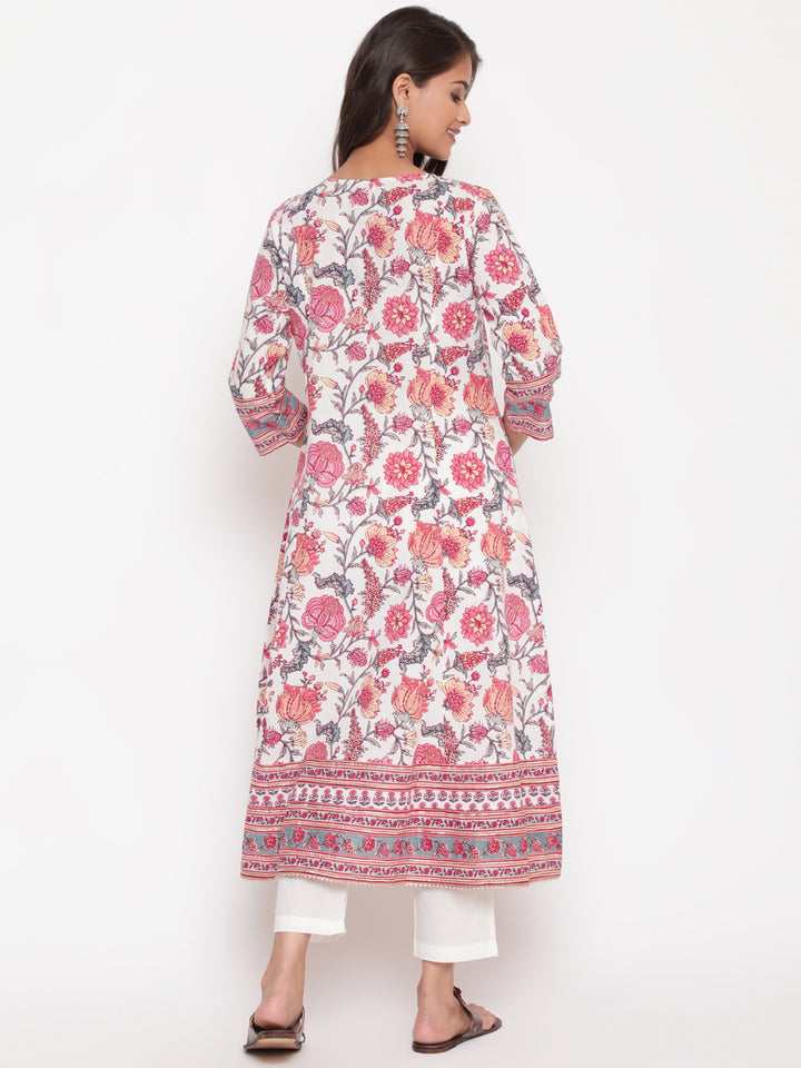 Woman posing in Savi's Pink Cotton Floral Printed Embellished Flared Kurta