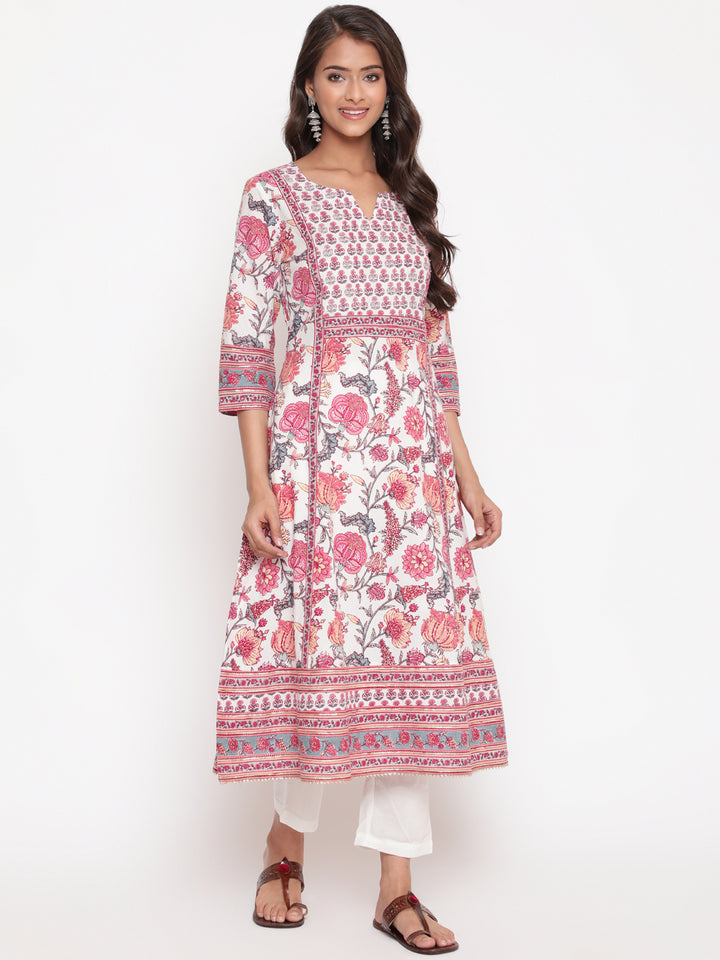 Woman posing in Savi's Pink Cotton Floral Printed Embellished Flared Kurta