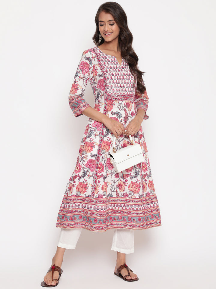 Woman posing in Savi's Pink Cotton Floral Printed Embellished Flared Kurta