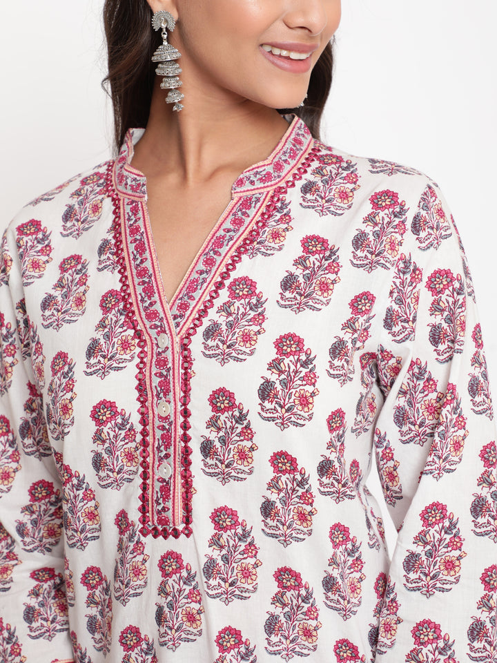 Woman posing in Savi's Paisely Cotton Printed White A Line Kurta With Printed Pant