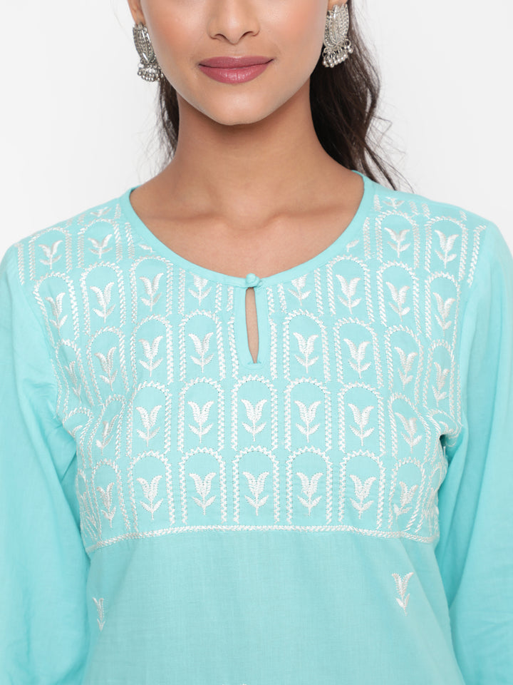 Woman posing in Embroidered Sky Blue Cotton Straight Fit Kurta by Savi