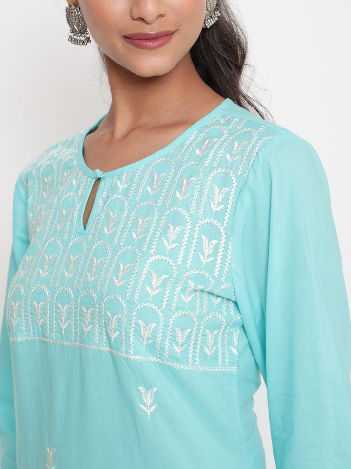 Woman posing in Embroidered Sky Blue Cotton Straight Fit Kurta by Savi