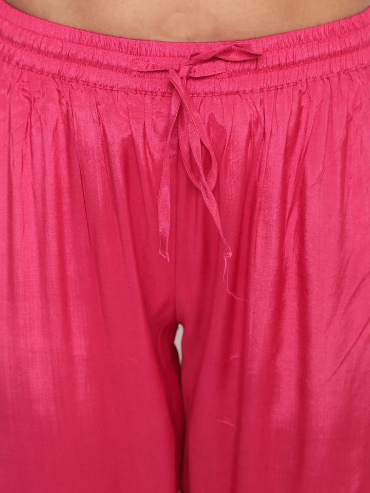 Woman posing in Savi’s Shantoon Embroidered straight Blue Kurta with Pink Pant