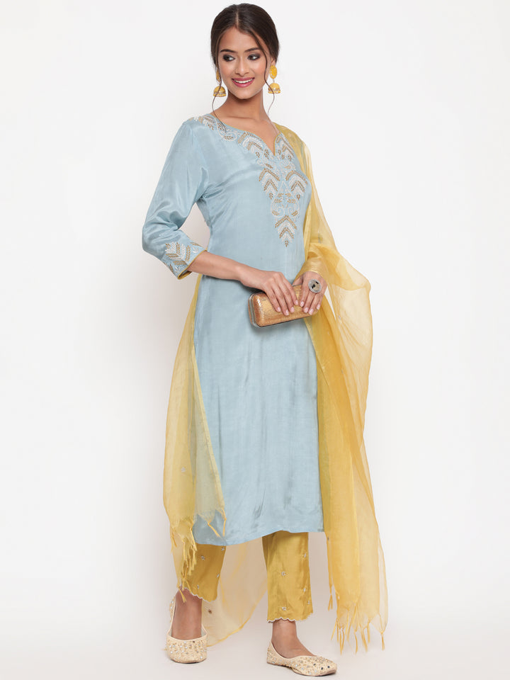 Woman posing in Powder Blue Embroidered Kurta Pant set With Organza Dupatta