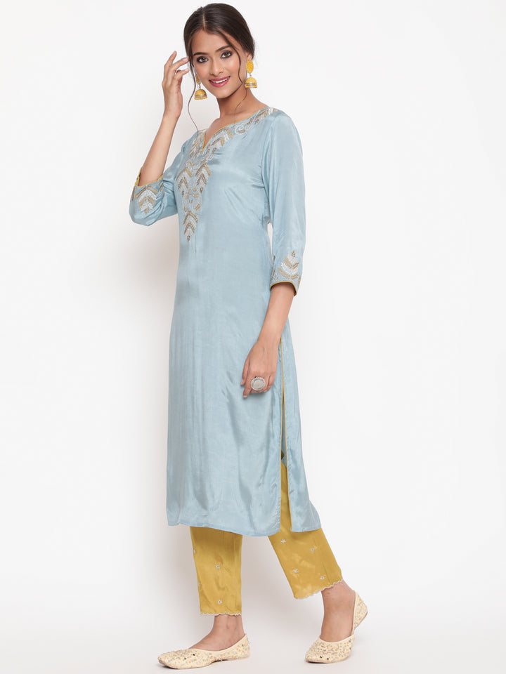Woman posing in Powder Blue Embroidered Kurta Pant set With Organza Dupatta