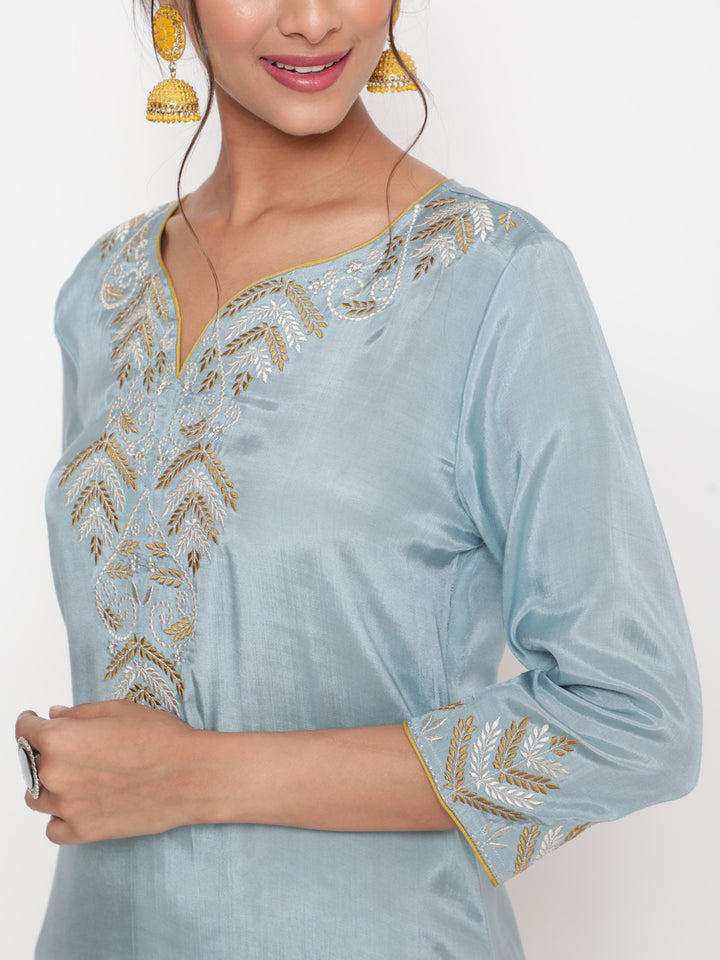 Woman posing in Powder Blue Embroidered Kurta Pant set With Organza Dupatta