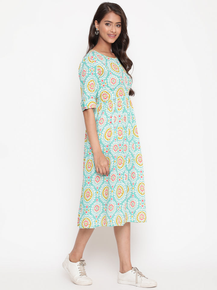 Woman posing in Mint Ikat Printed Knee Length Designer Dress