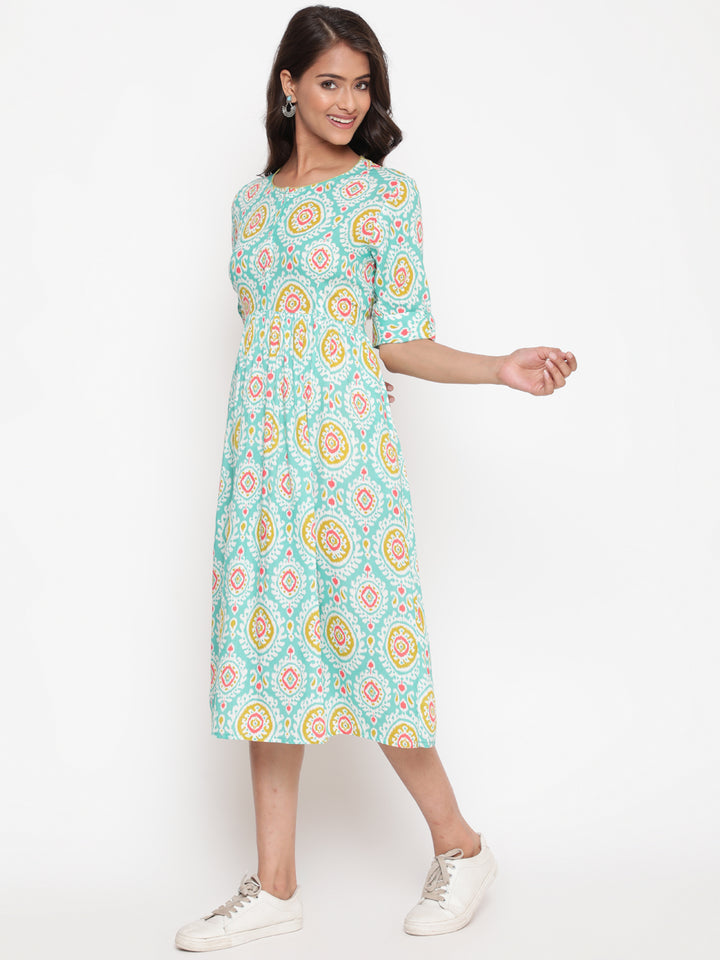 Woman posing in Mint Ikat Printed Knee Length Designer Dress