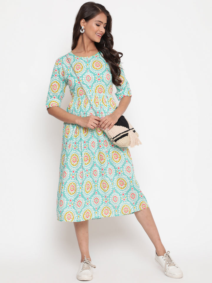 Woman posing in Mint Ikat Printed Knee Length Designer Dress