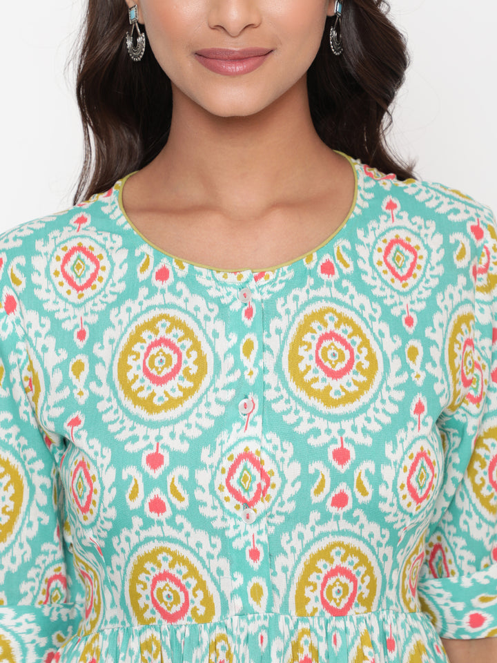 Woman posing in Mint Ikat Printed Knee Length Designer Dress