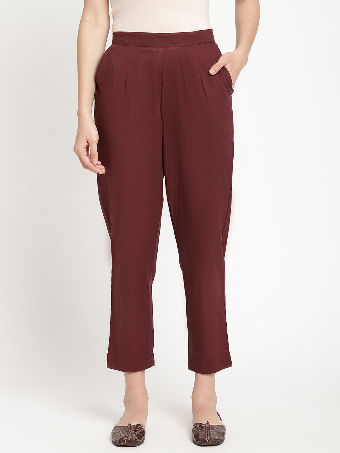Model wearing straight-fit maroon cotton pants.