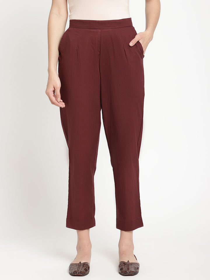 Model wearing straight-fit maroon cotton pants.