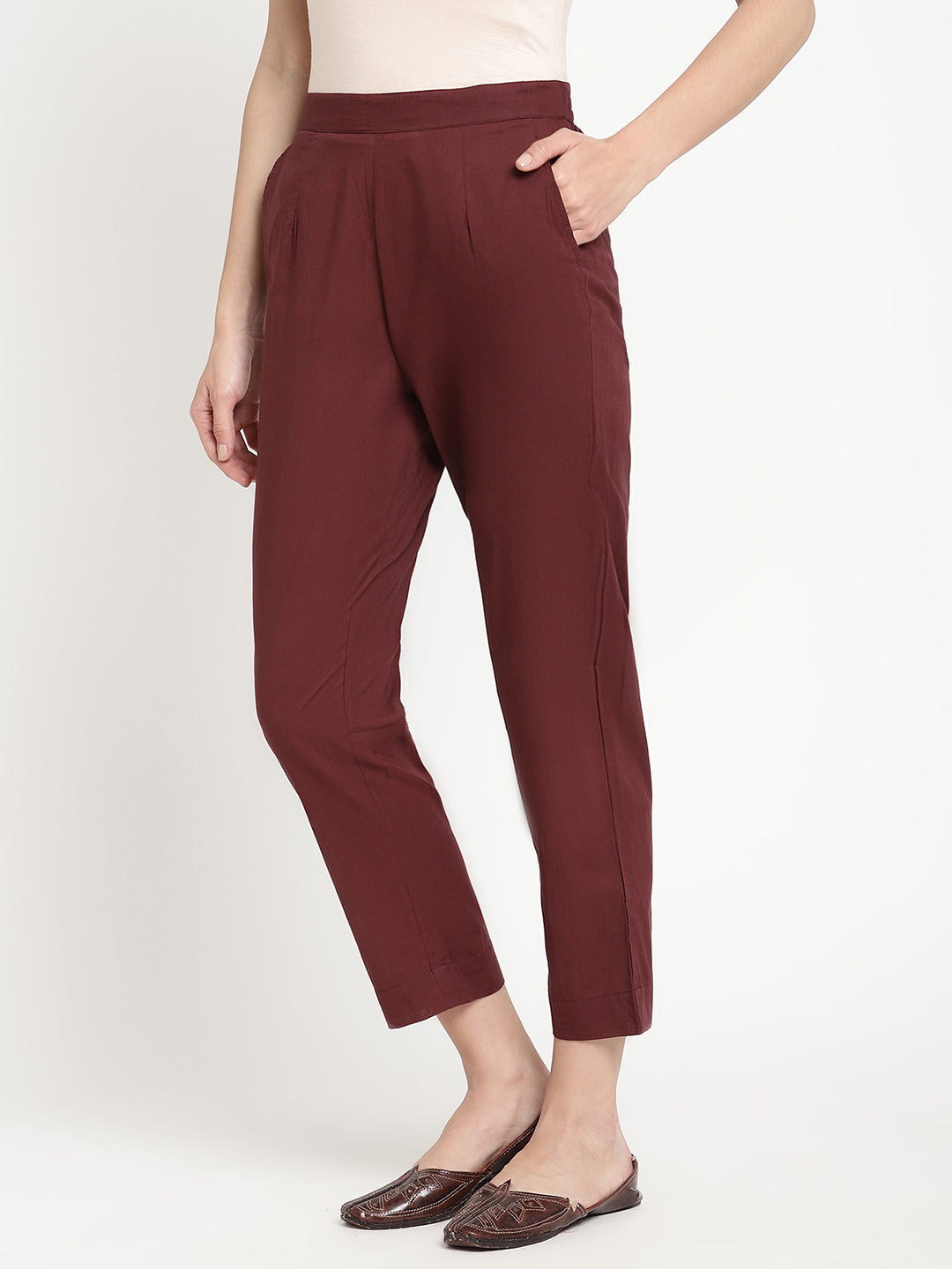 Model wearing straight-fit maroon cotton pants.