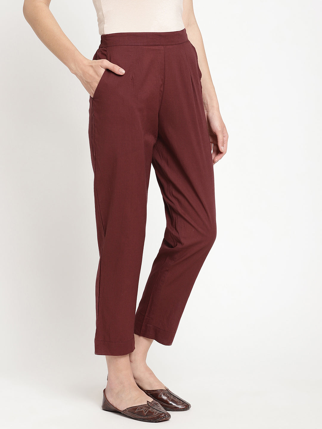Model wearing straight-fit maroon cotton pants.