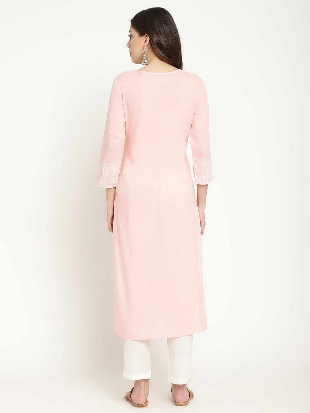 Model posing in a pink cotton embroidered Kurta.