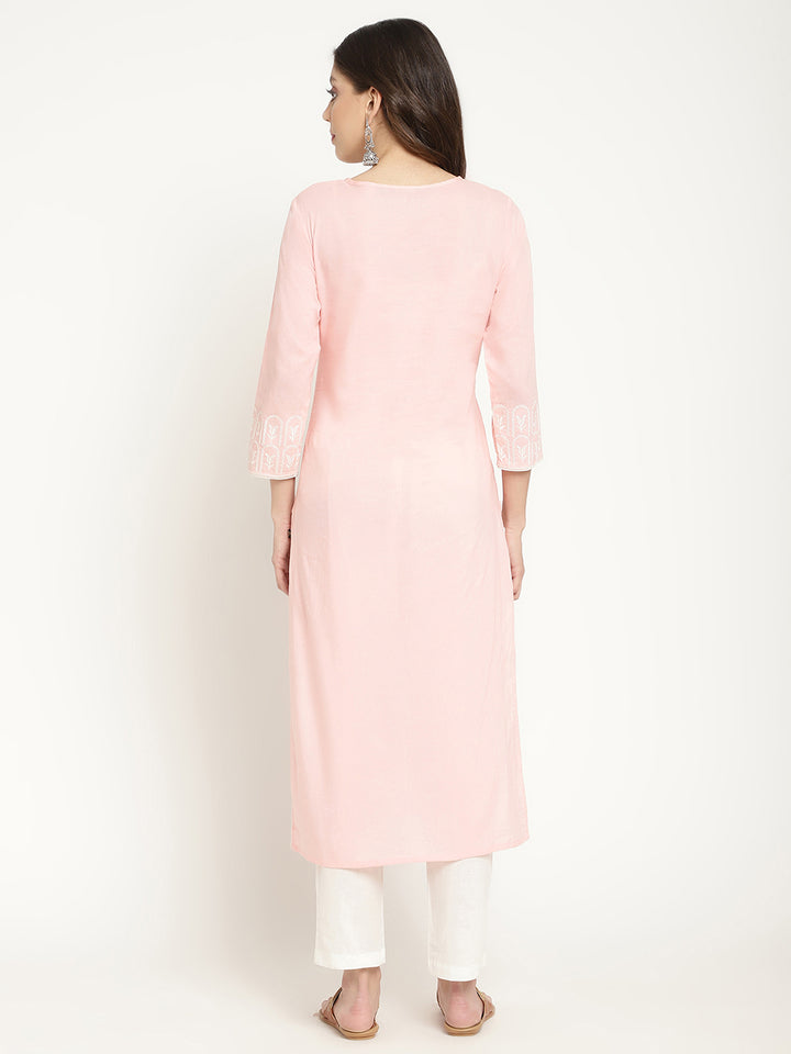 Model posing in a pink cotton embroidered Kurta.