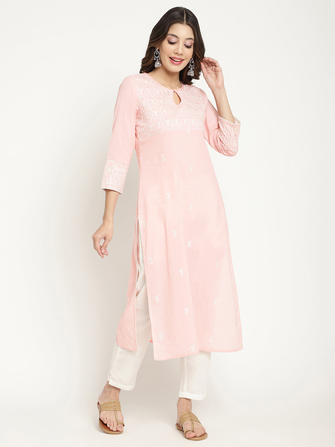Model posing in a pink cotton embroidered Kurta.