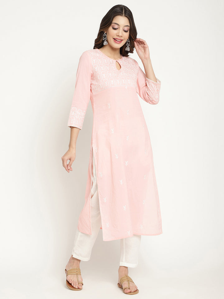 Model posing in a pink cotton embroidered Kurta.