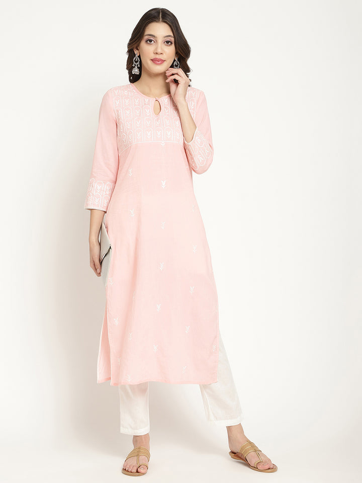 Model posing in a pink cotton embroidered Kurta.