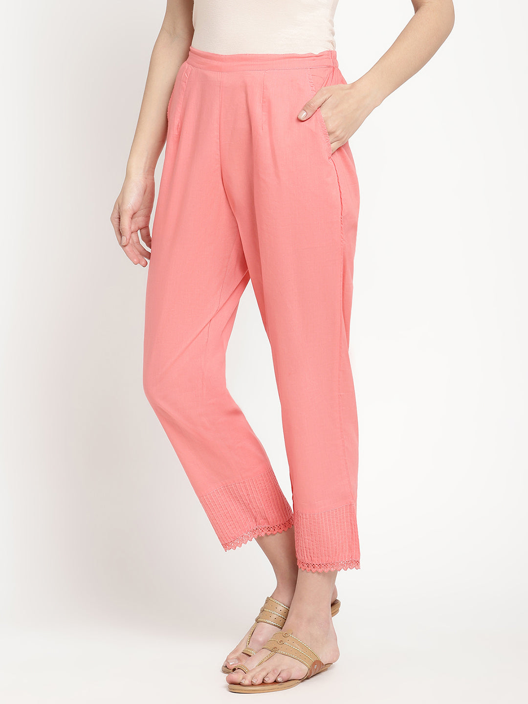 Model wearing pink cotton straight fit pants.