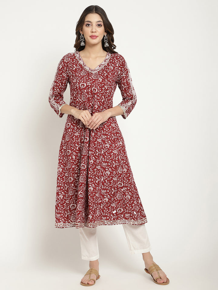 Woman posing in a flared Kurta against a white background.
