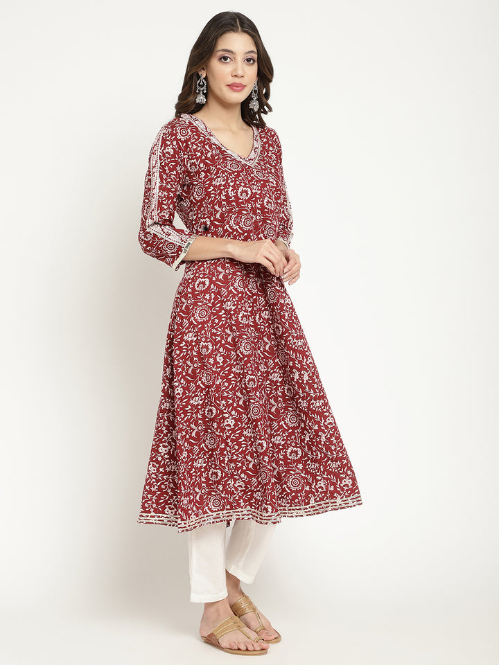 Woman posing in a flared Kurta against a white background.