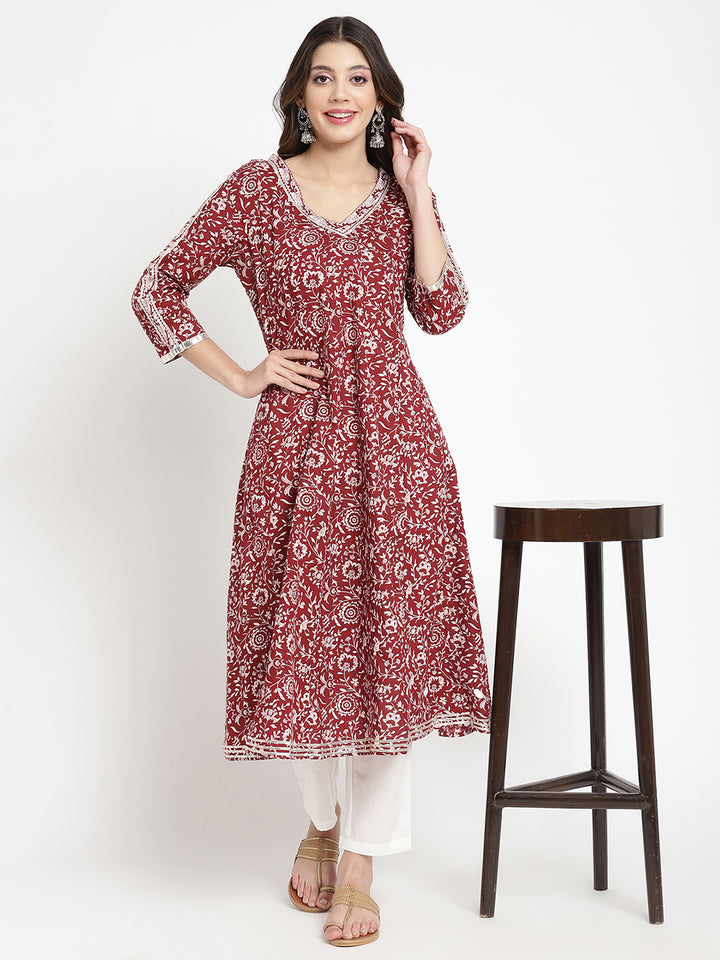 Woman posing in a flared Kurta against a white background.