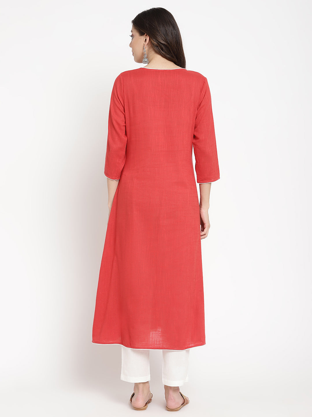 Woman wearing a red embroidered Kurta in an A-line silhouette.