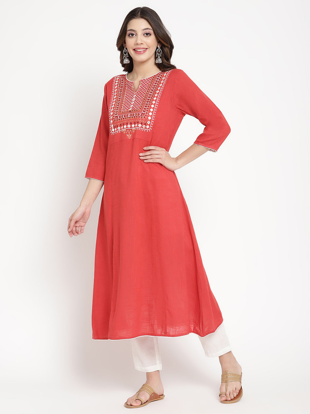 Woman wearing a red embroidered Kurta in an A-line silhouette.