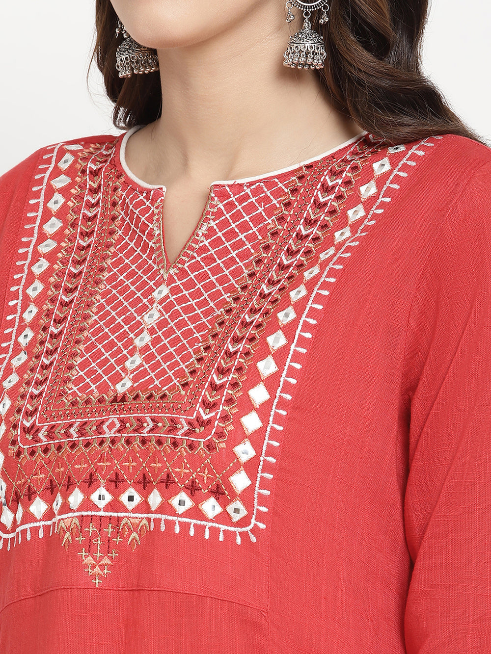 Woman wearing a red embroidered Kurta in an A-line silhouette.
