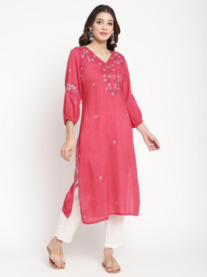 Woman standing in Rose Pink Embroidered A Line Kurta by Savi.