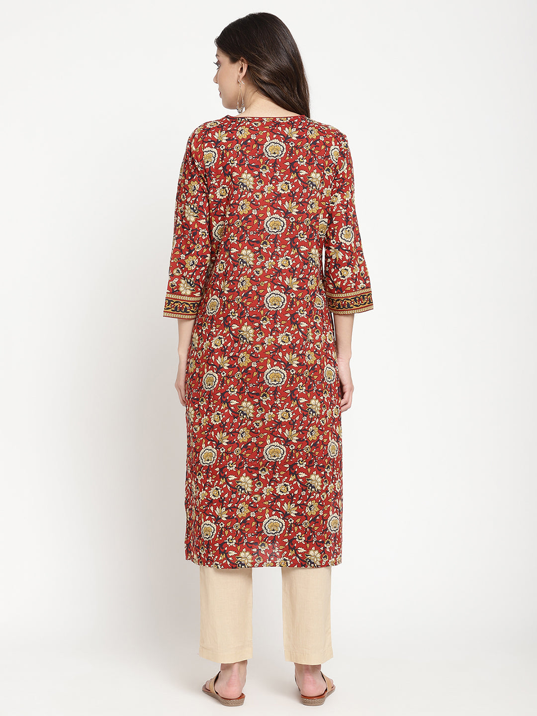 Model standing and wearing a rust Kurta with a straight-fit.